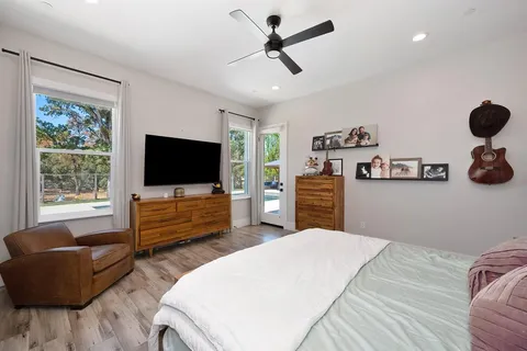 a bathroom with a double vanity sink a mirror and a shower
