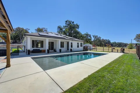 a aerial view of a house with a yard