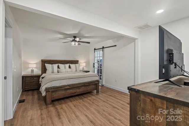 a bedroom with a bed and a table