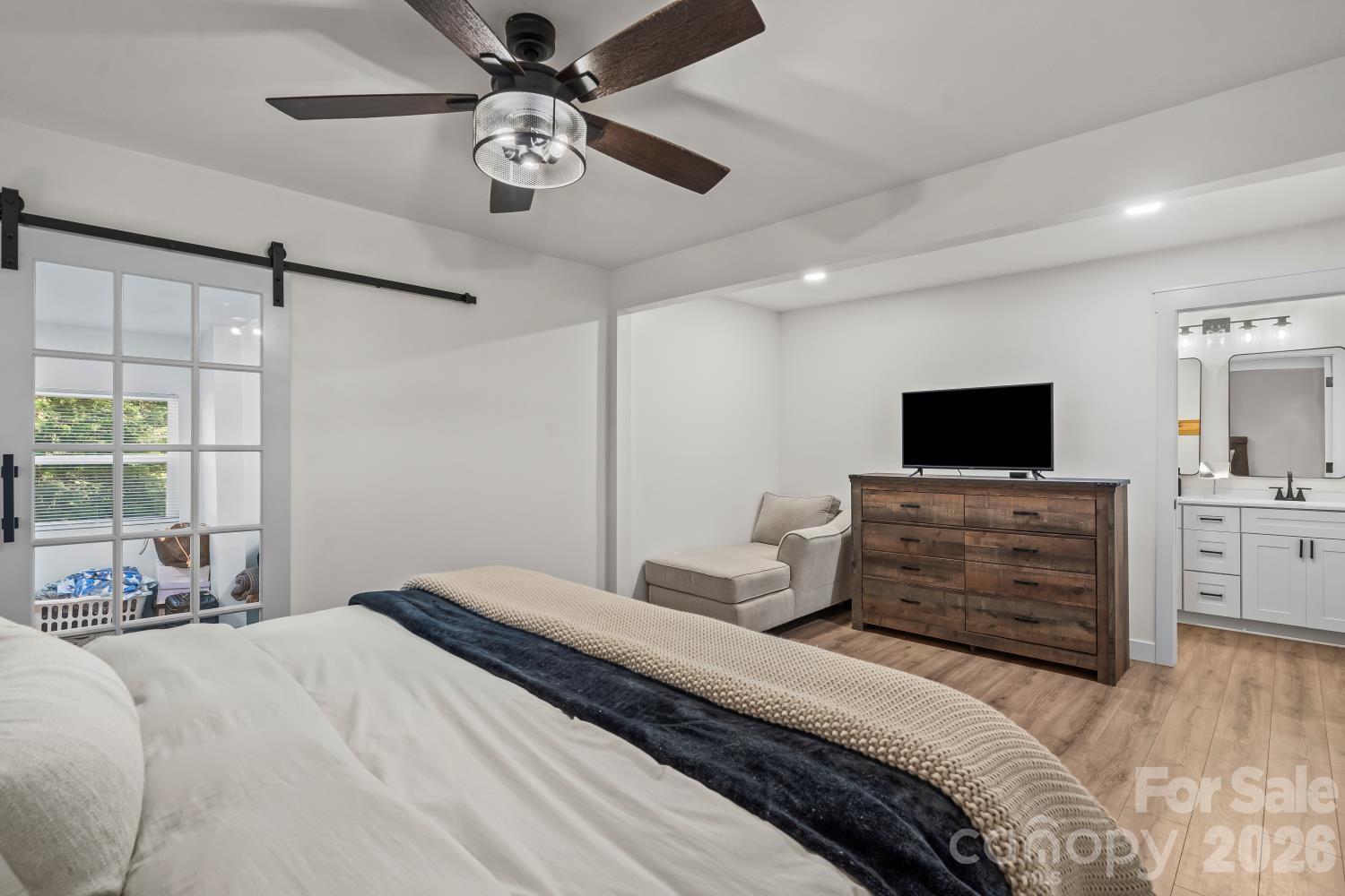 5740 Crouse Road Crouse, NC 28033 - Photo 12 of 28 a bedroom with a bed and a flat screen tv