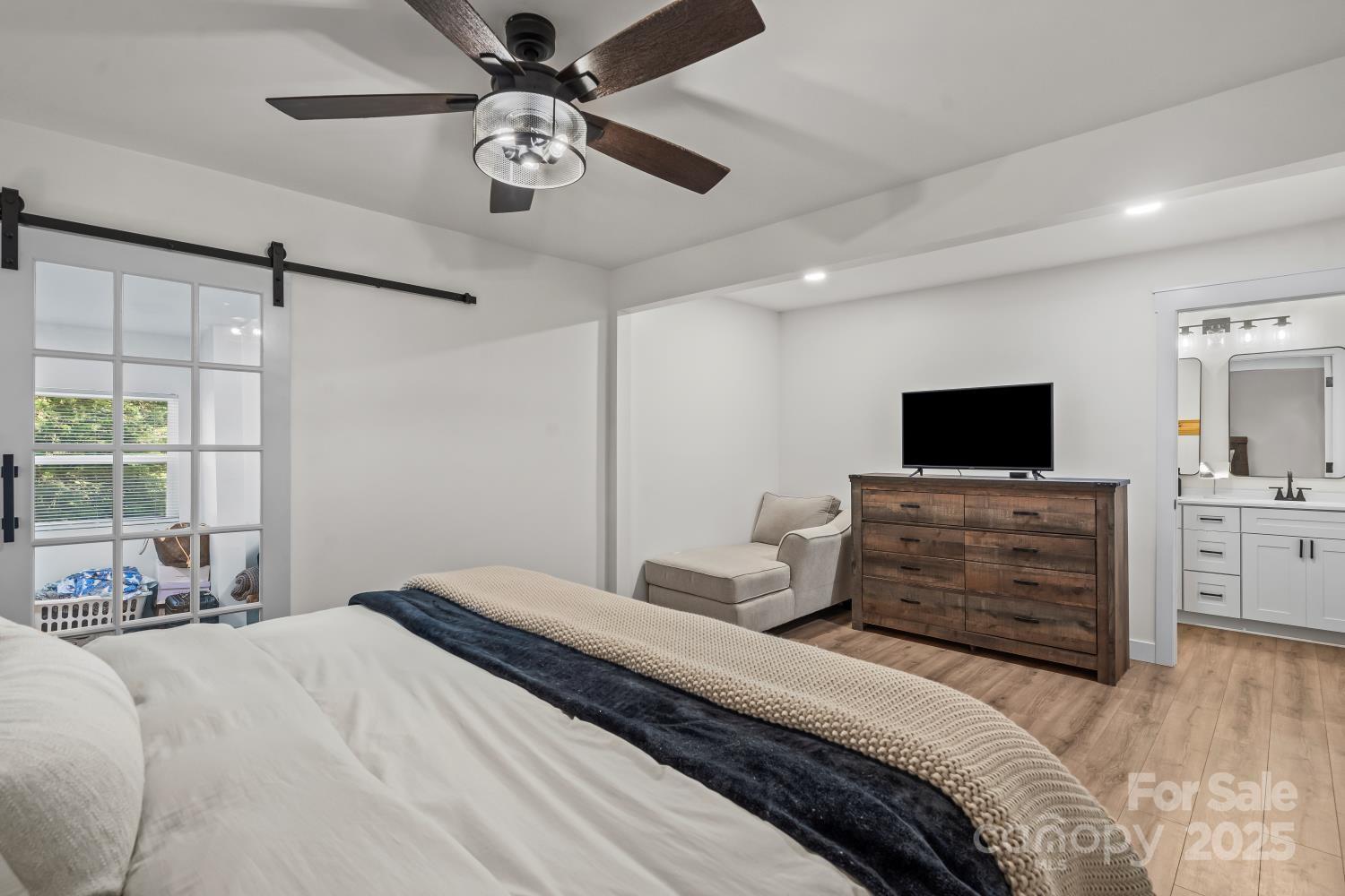 5740 Crouse Road Crouse, NC 28033 - Photo 13 of 28 a bedroom with a bed and a flat screen tv