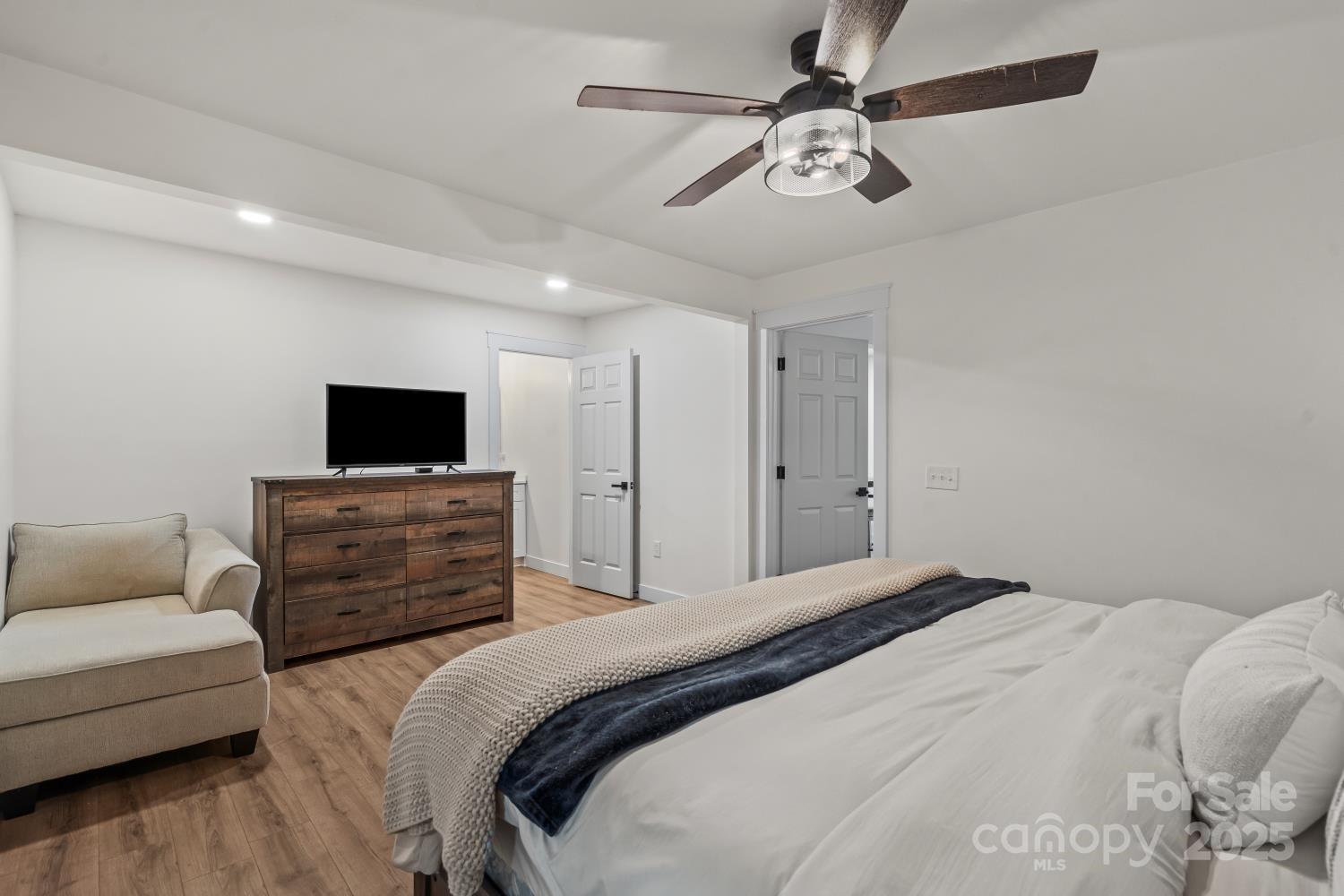 5740 Crouse Road Crouse, NC 28033 - Photo 14 of 28 a bedroom with a bed and a flat screen tv