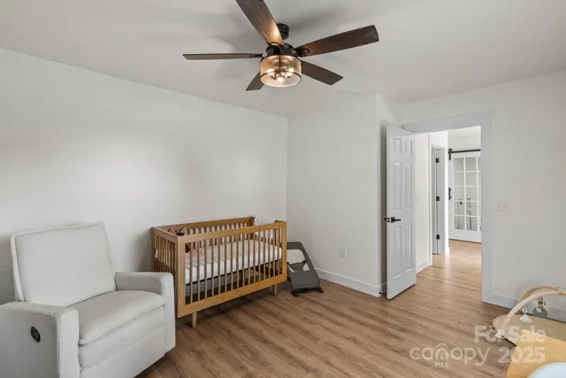 a view of a livingroom with furniture and hardwood floor