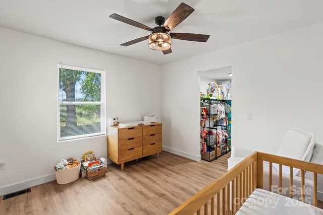 a bedroom with furniture and a window