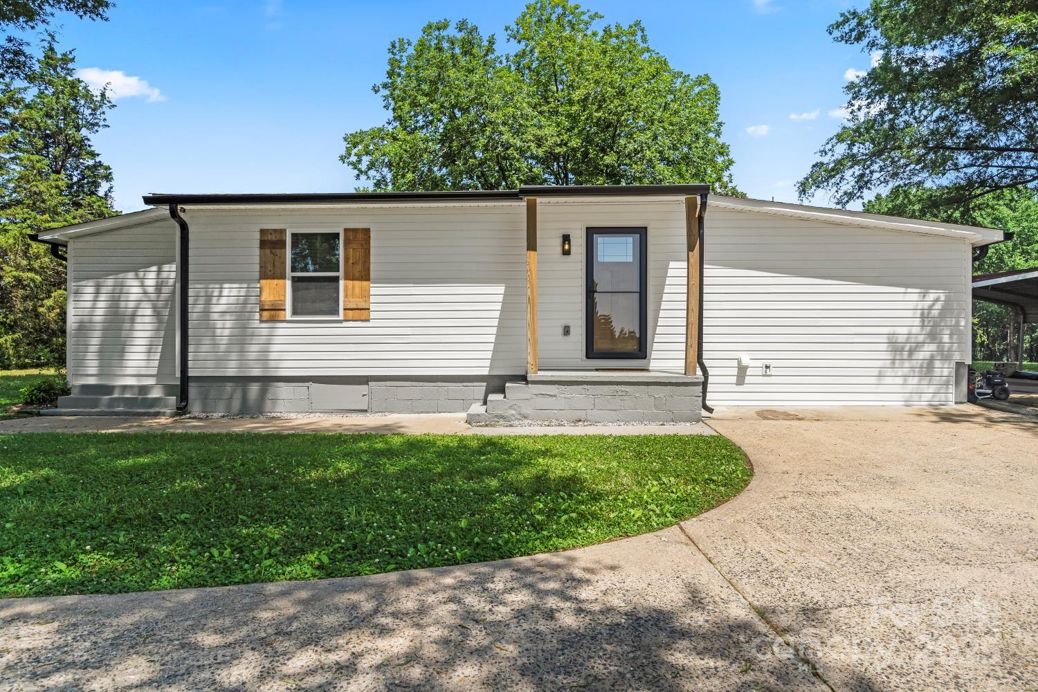 5740 Crouse Road Crouse, NC 28033 - Photo 2 of 28 a view of a house with a backyard