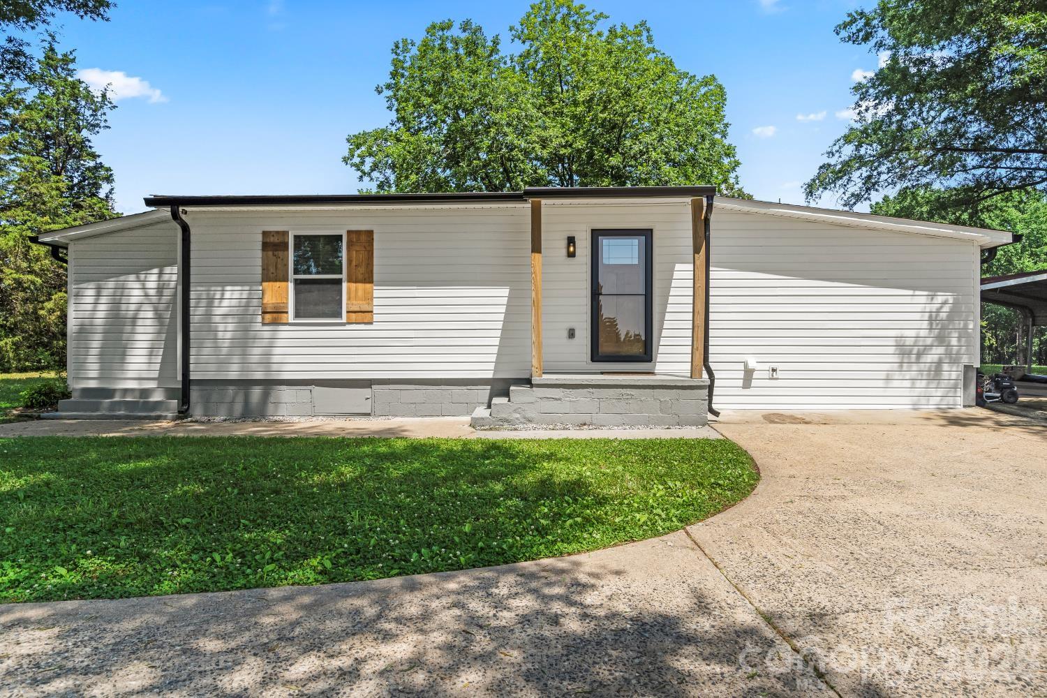 5740 Crouse Road Crouse, NC 28033 - Photo 2 of 28 a view of a house with a backyard