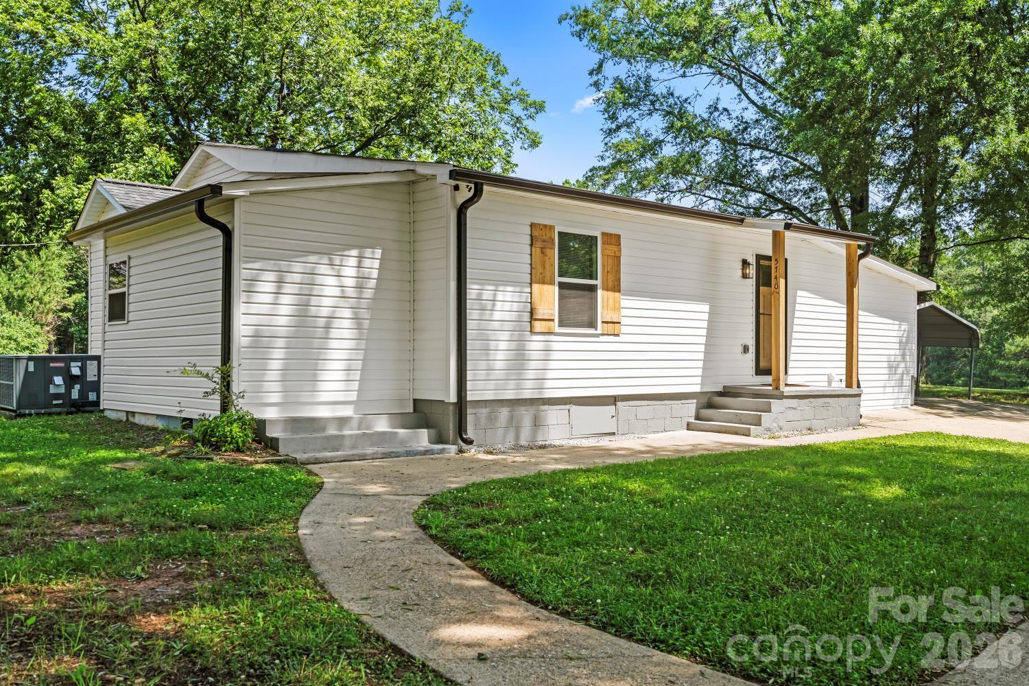 5740 Crouse Road Crouse, NC 28033 - Photo 2 of 28 a front view of a house with a yard and porch