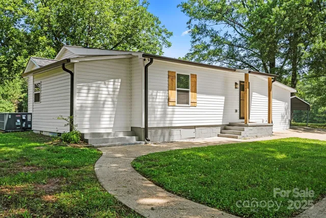 a front view of a house with a yard and porch