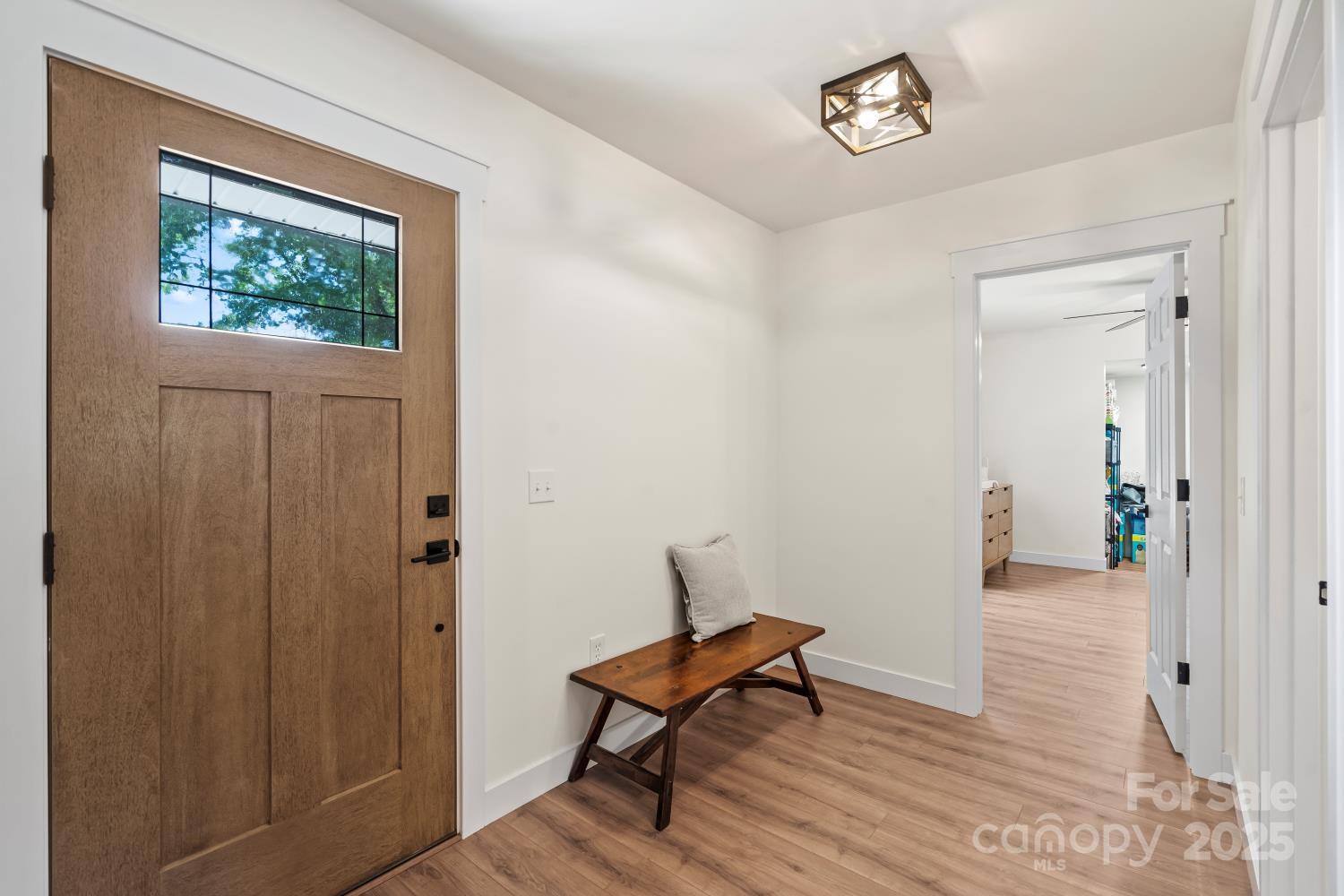 5740 Crouse Road Crouse, NC 28033 - Photo 4 of 28 a view of a room with wooden floor a ceiling fan and windows