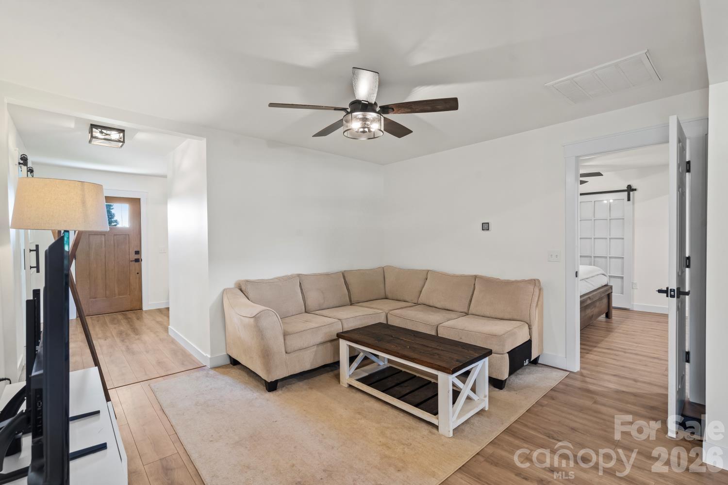 5740 Crouse Road Crouse, NC 28033 - Photo 9 of 28 a living room with furniture a ceiling fan and a rug