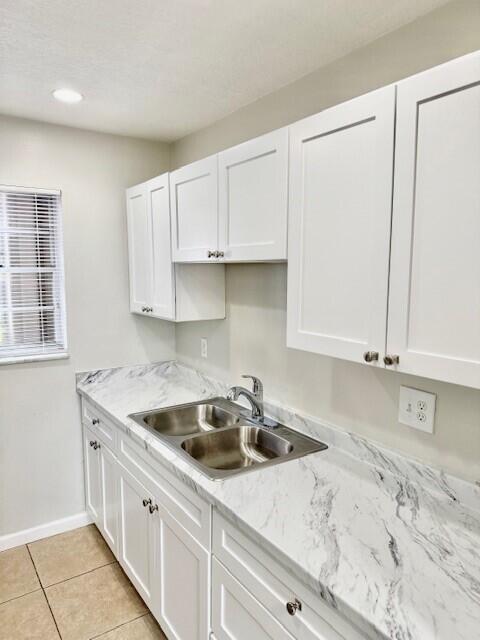 650 Southwest 2nd Avenue, Unit 253 Boca Raton, FL 33432 - Photo 13 of 32 a kitchen with a sink and cabinets