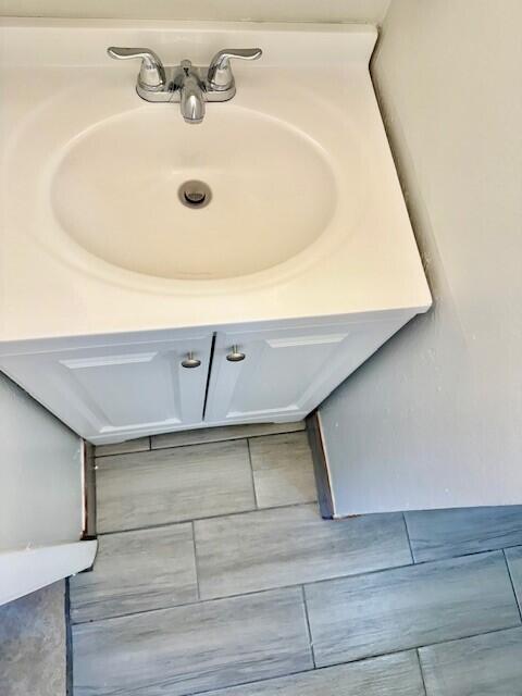 650 Southwest 2nd Avenue, Unit 253 Boca Raton, FL 33432 - Photo 16 of 32 a bathroom with a sink and mirror