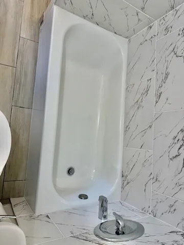 a bathroom with a toilet and a sink