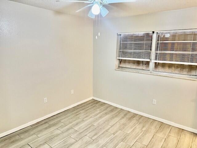 650 Southwest 2nd Avenue, Unit 253 Boca Raton, FL 33432 - Photo 27 of 32 an empty room with a window