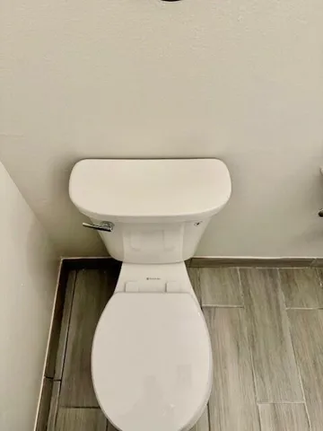 a bathroom with a sink a mirror and a toilet