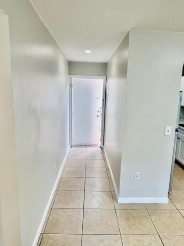 a view of an empty room with a bathroom