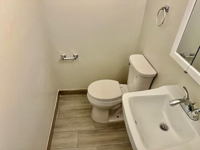 650 Southwest 2nd Avenue, Unit 253 Boca Raton, FL 33432 - Photo 31 of 32 a bathroom with a sink and a toilet