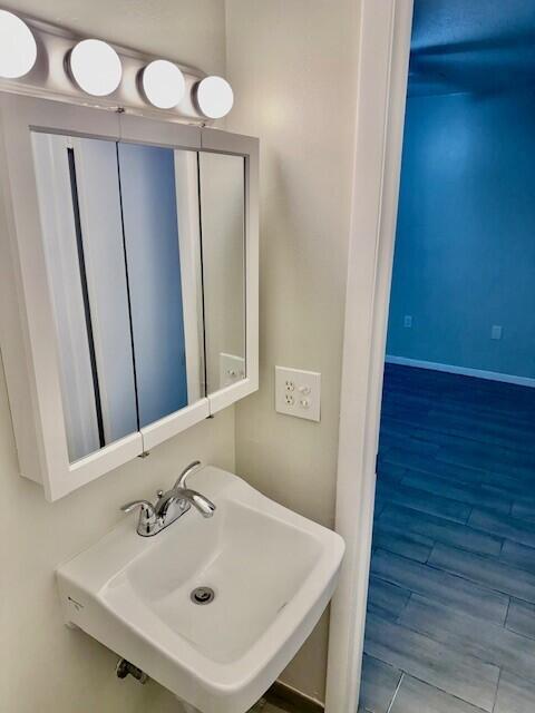 650 Southwest 2nd Avenue, Unit 253 Boca Raton, FL 33432 - Photo 32 of 32 a bathroom with a sink a mirror and a toilet