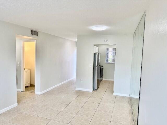 650 Southwest 2nd Avenue, Unit 253 Boca Raton, FL 33432 - Photo 4 of 32 a view of an empty room with a bathroom