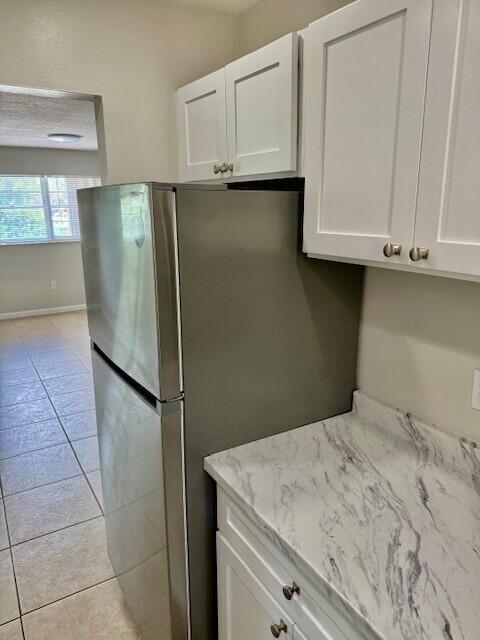 650 Southwest 2nd Avenue, Unit 253 Boca Raton, FL 33432 - Photo 9 of 32 a kitchen with stainless steel appliances granite countertop a refrigerator sink and cabinets