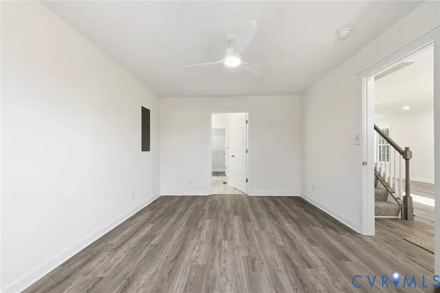 a view of room with wooden floor and window