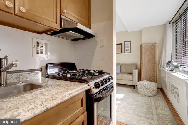 a kitchen with a stove and a sink