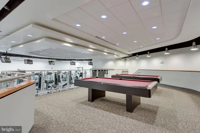 a room with furniture and pool table