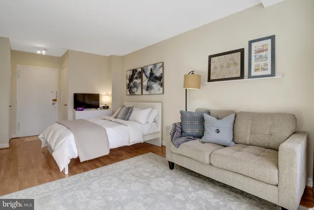 a bedroom with a bed and a couch