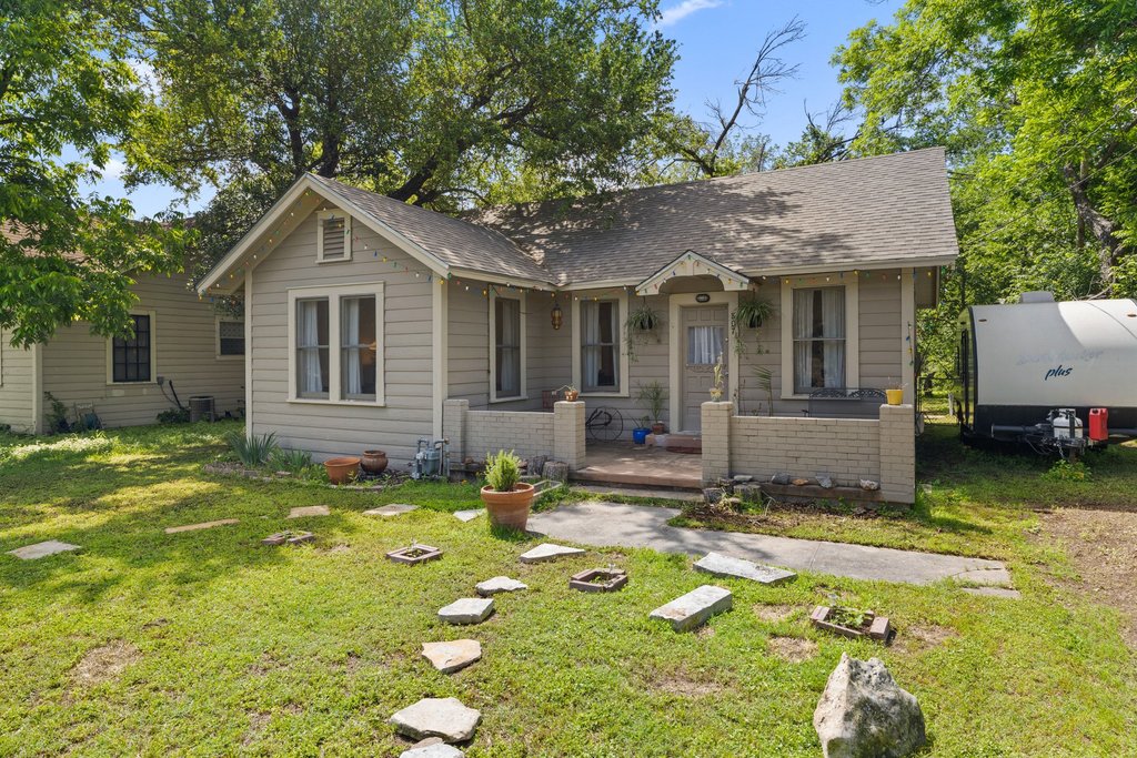807 Cecelia Street Taylor, TX 76574 - Photo 2 of 24 a view of a house with swimming pool and sitting area