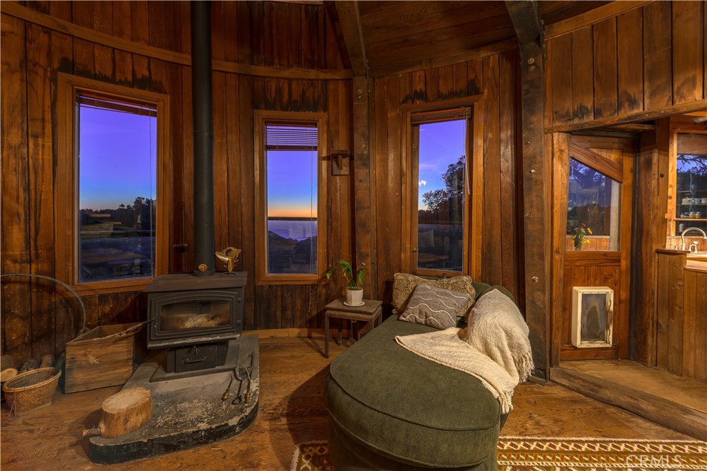 0 Pias Ranch Road Big Sur, CA 93920 - Photo 11 of 34 a living room with furniture and a potted plant