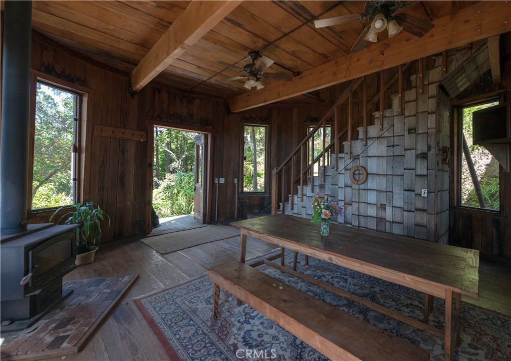 0 Pias Ranch Road Big Sur, CA 93920 - Photo 16 of 34 a living room with furniture and a fireplace