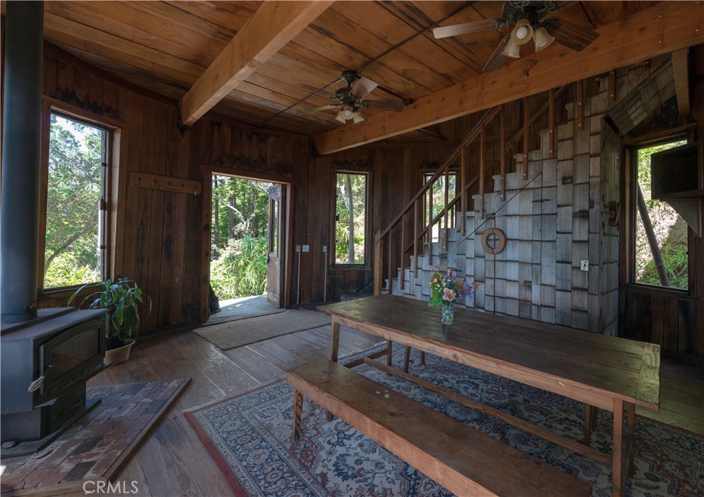 0 Pias Ranch Road Big Sur, CA 93920 - Photo 16 of 34 a living room with furniture and a fireplace