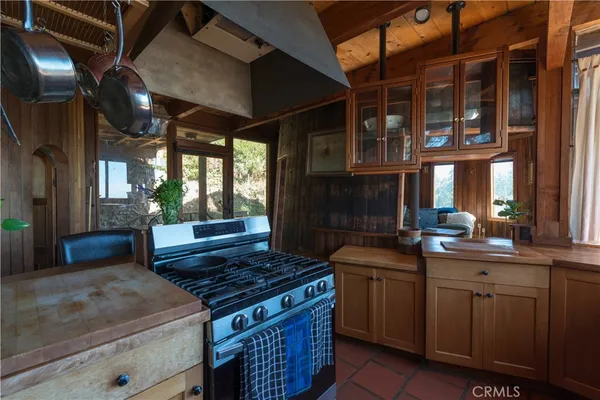 a kitchen with a stove and a sink