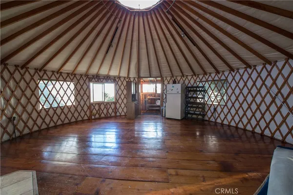 a view of wooden floor with windows