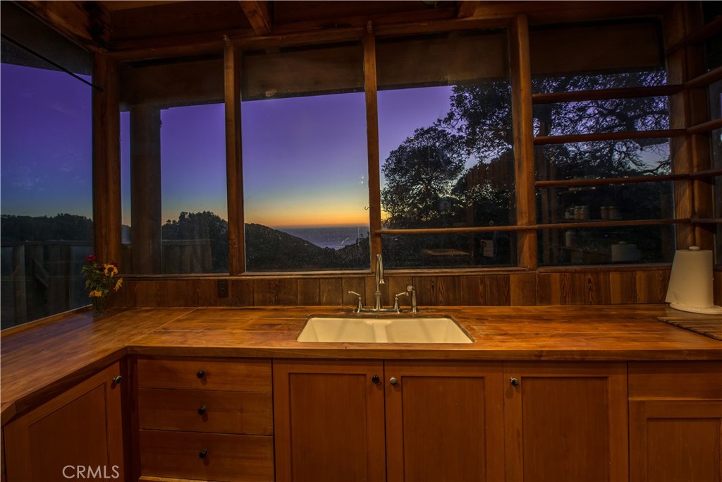 0 Pias Ranch Road Big Sur, CA 93920 - Photo 9 of 34 a bathroom with a sink and a mirror