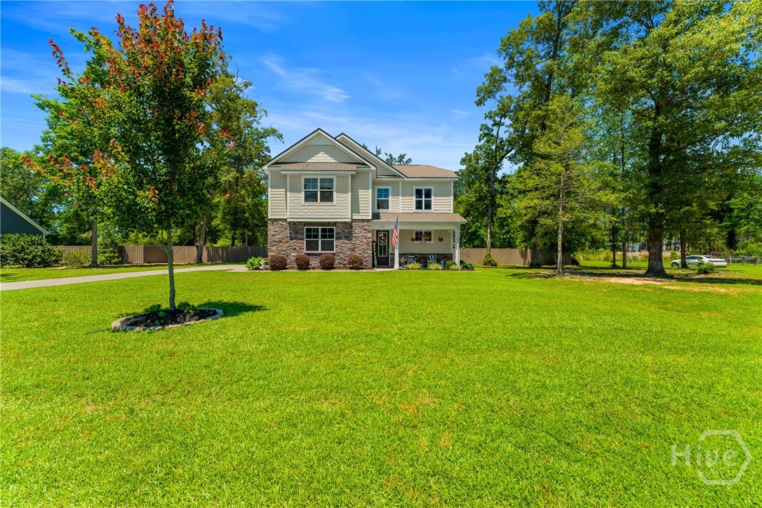 132 Ramsey Way Rincon, GA 31326 - Photo 6 of 59 The kind of front yard that makes you slow down when you drive by.