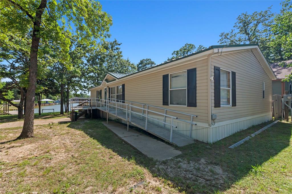 194 Indian Gap Road Mabank, TX 75156 - Photo 17 of 18 a view of a house with a yard