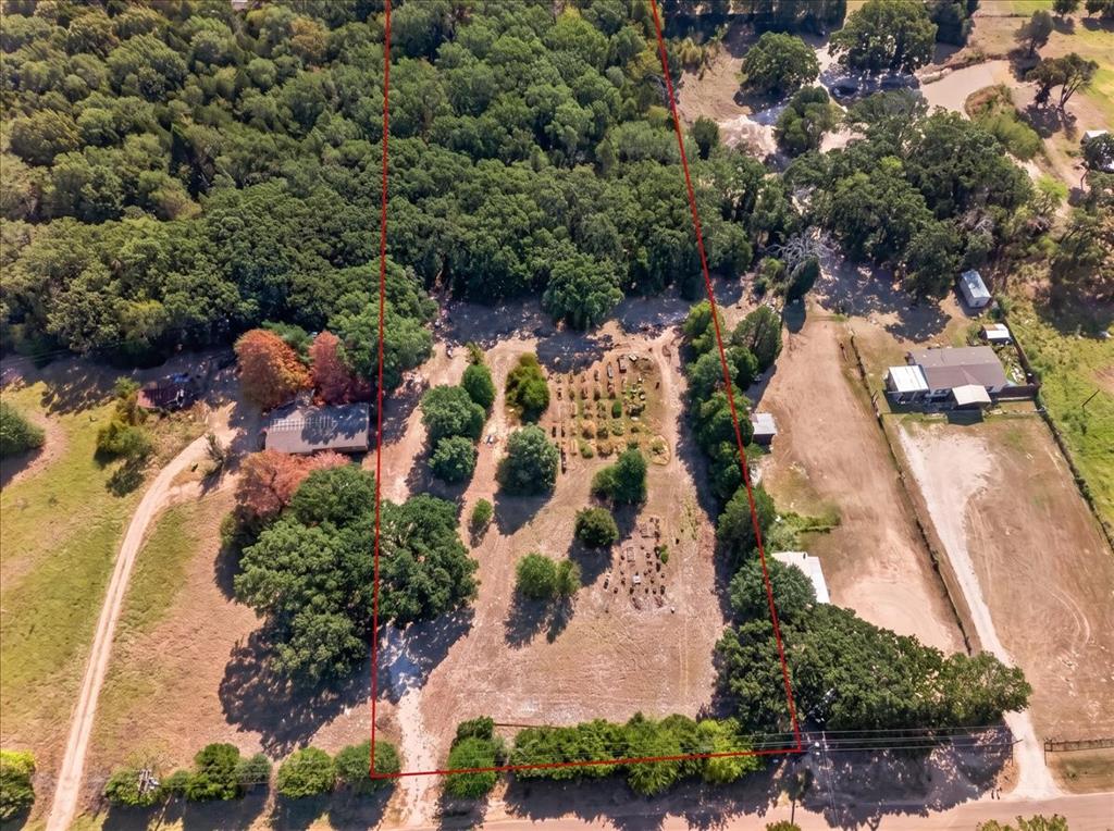 Items Virtually removed. Expansive acreage featuring mature trees, wooded areas, and a visible pond