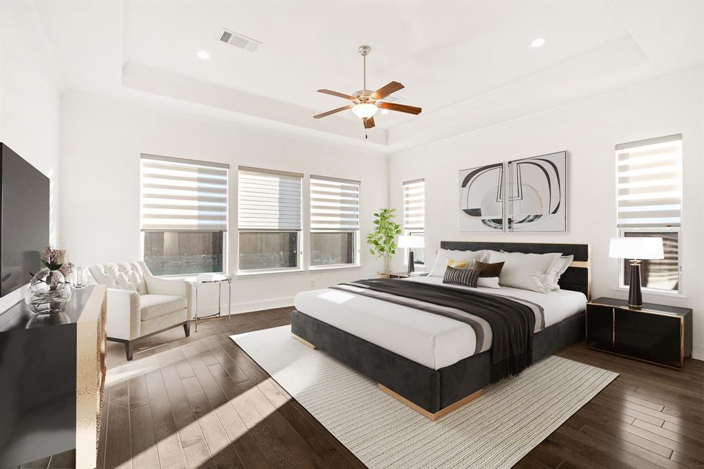 2441 Flat Creek Road Frisco, TX 75036 - Photo 15 of 34 a spacious bedroom with a large bed and a large window