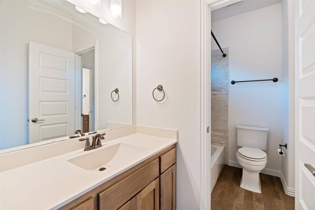 2441 Flat Creek Road Frisco, TX 75036 - Photo 24 of 34 a bathroom with a sink toilet and shower