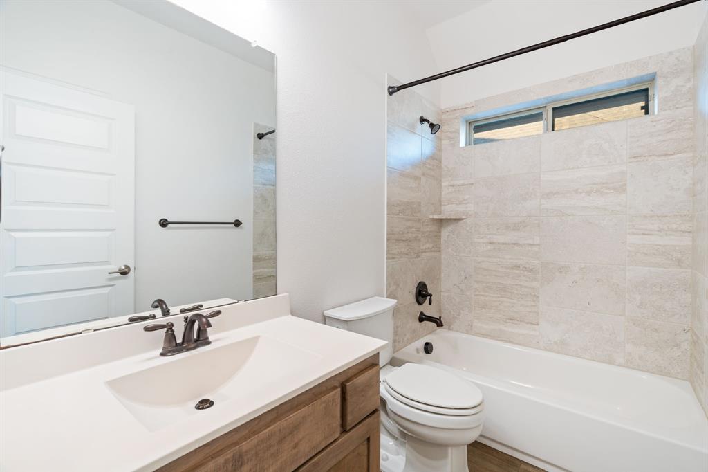 2441 Flat Creek Road Frisco, TX 75036 - Photo 28 of 34 a bathroom with a sink toilet and shower