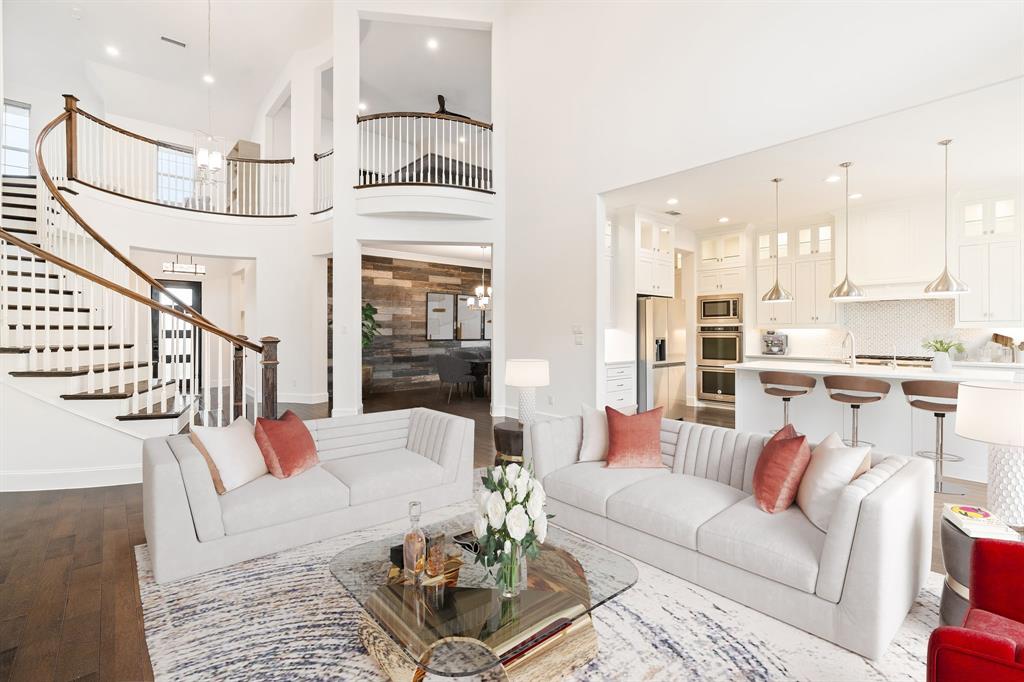 2441 Flat Creek Road Frisco, TX 75036 - Photo 5 of 34 a living room with furniture kitchen view and a large window