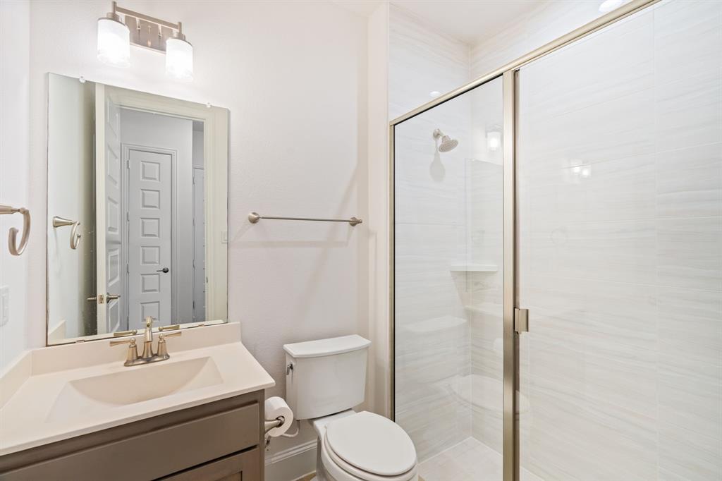 2441 Flat Creek Road Frisco, TX 75036 - Photo 8 of 34 a bathroom with a sink toilet and shower