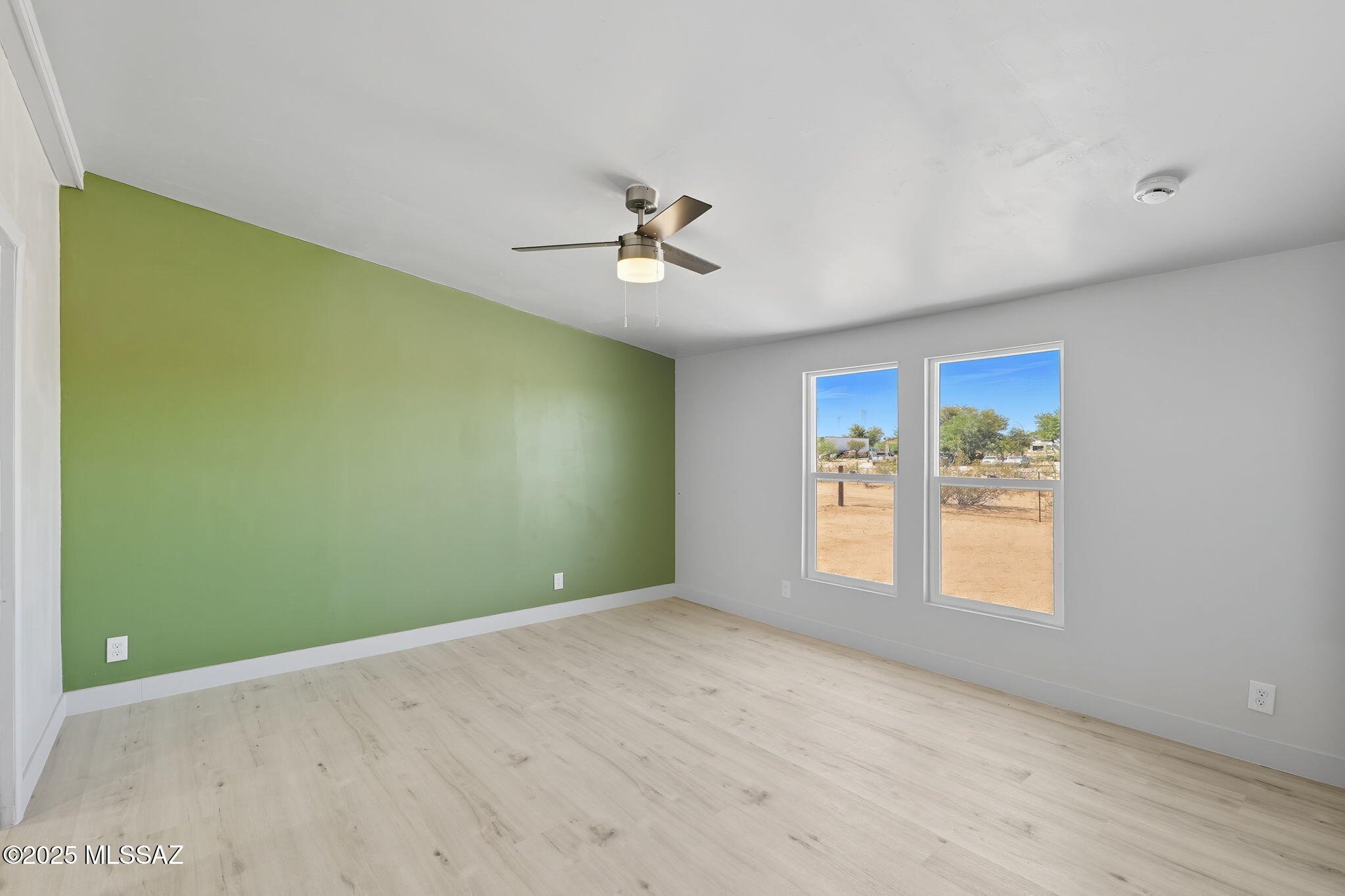 8790 North Trico Road Marana, AZ 85653 - Photo 12 of 35 a view of an empty room with a window