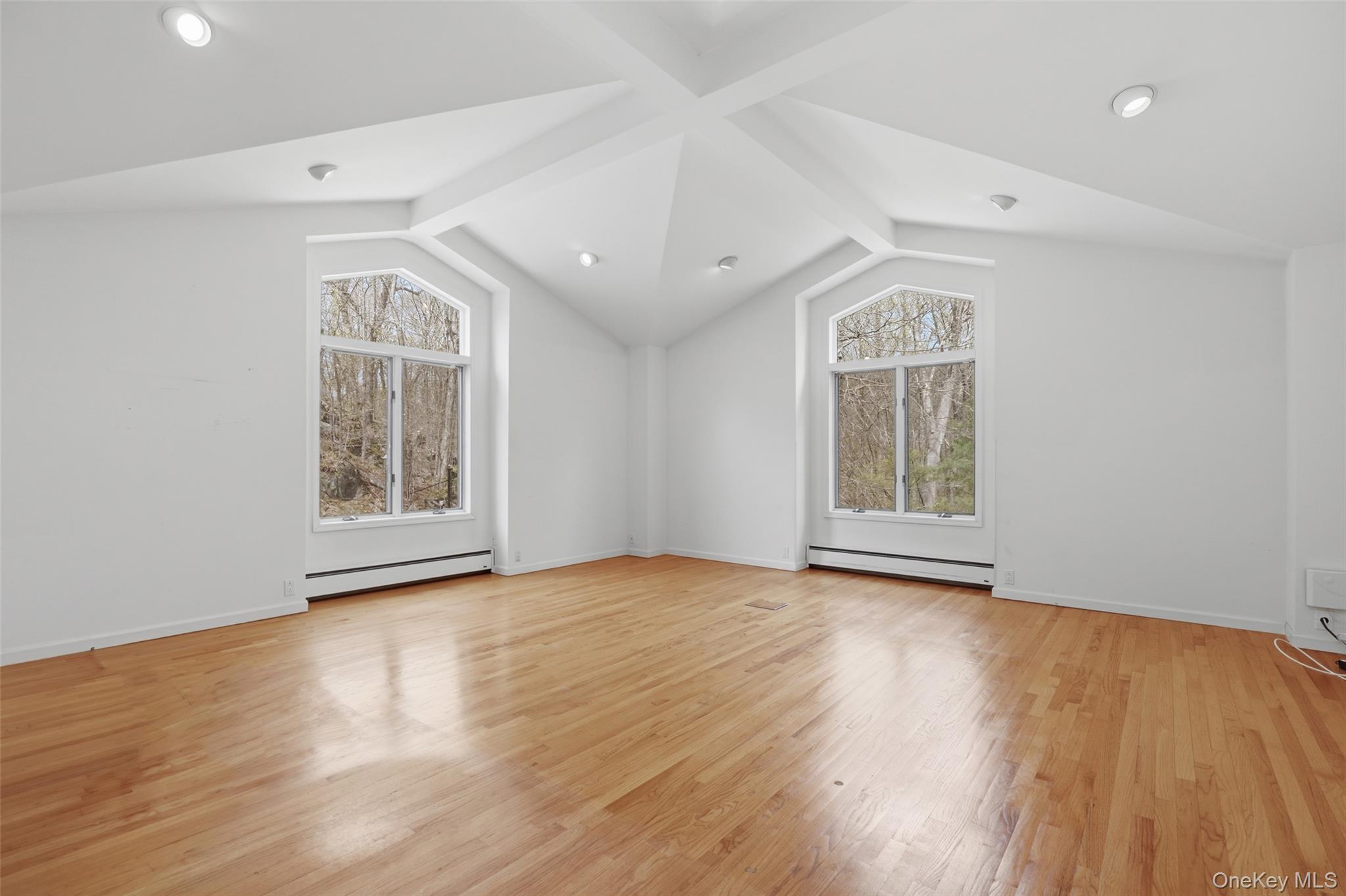 68 Old Aspetong Road Katonah, NY 10536 - Photo 11 of 13 a view of an empty room with wooden floor and a window