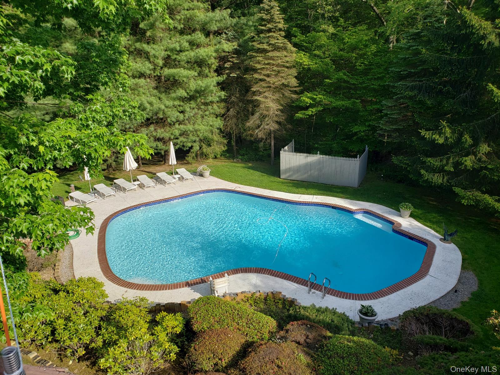 68 Old Aspetong Road Katonah, NY 10536 - Photo 13 of 13 an aerial view of a swimming pool with a yard