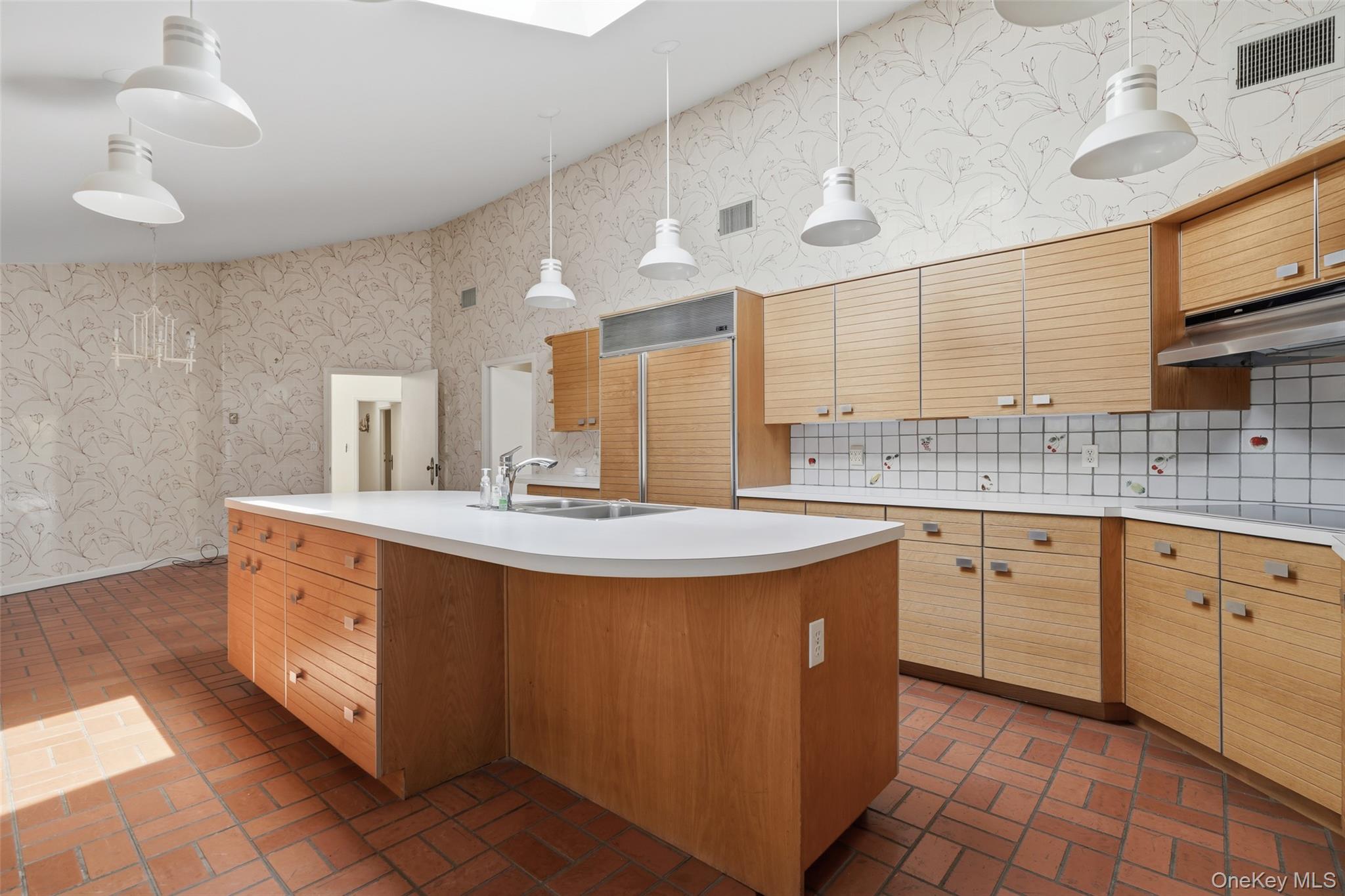 68 Old Aspetong Road Katonah, NY 10536 - Photo 10 of 13 a kitchen with stainless steel appliances a sink stove and cabinets