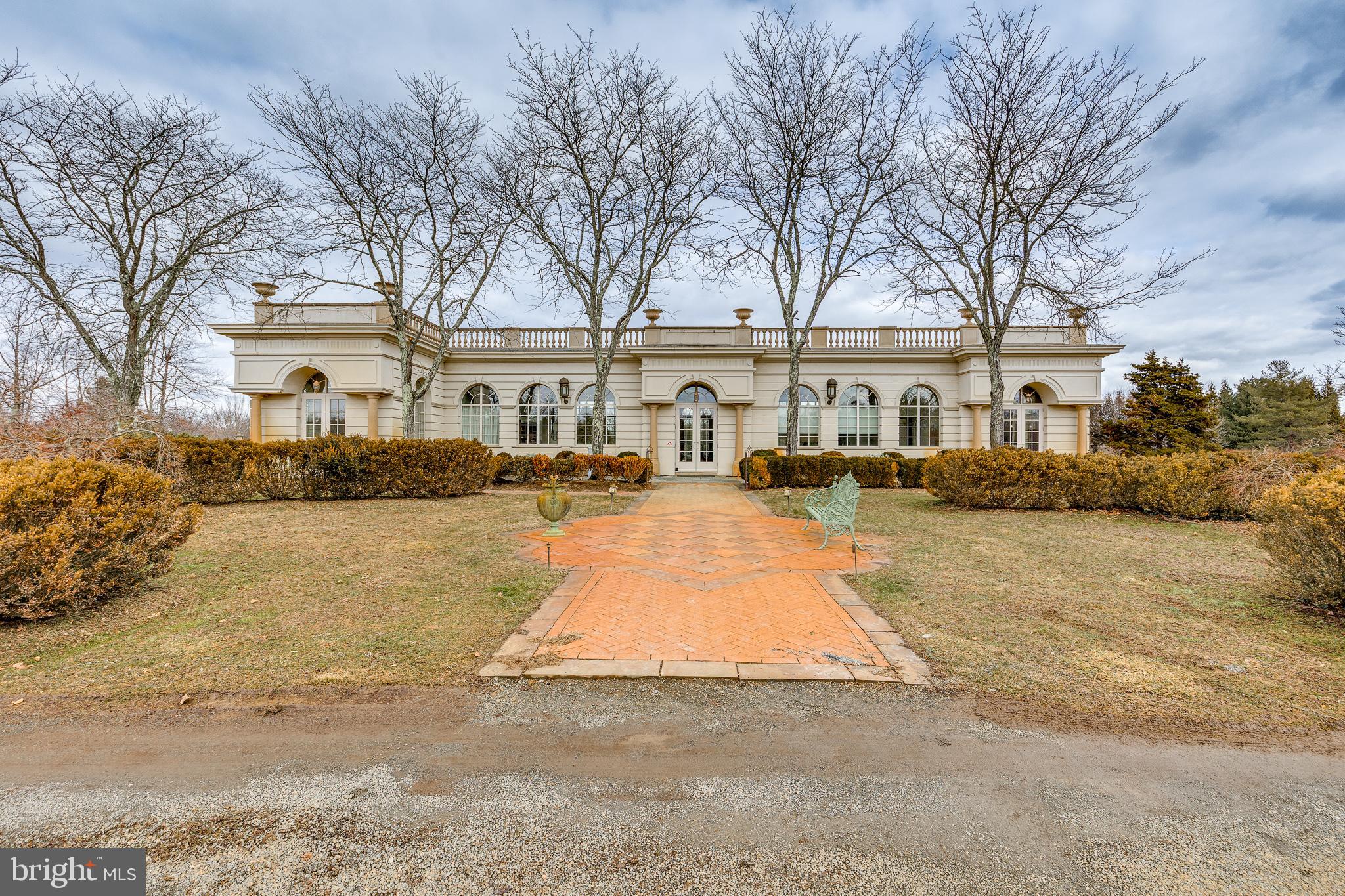 139 Bordentown Georgetown Road Chesterfield, NJ 08515 - Photo 1 of 89 a view of a white house next to a yard with a fountain and a large tree