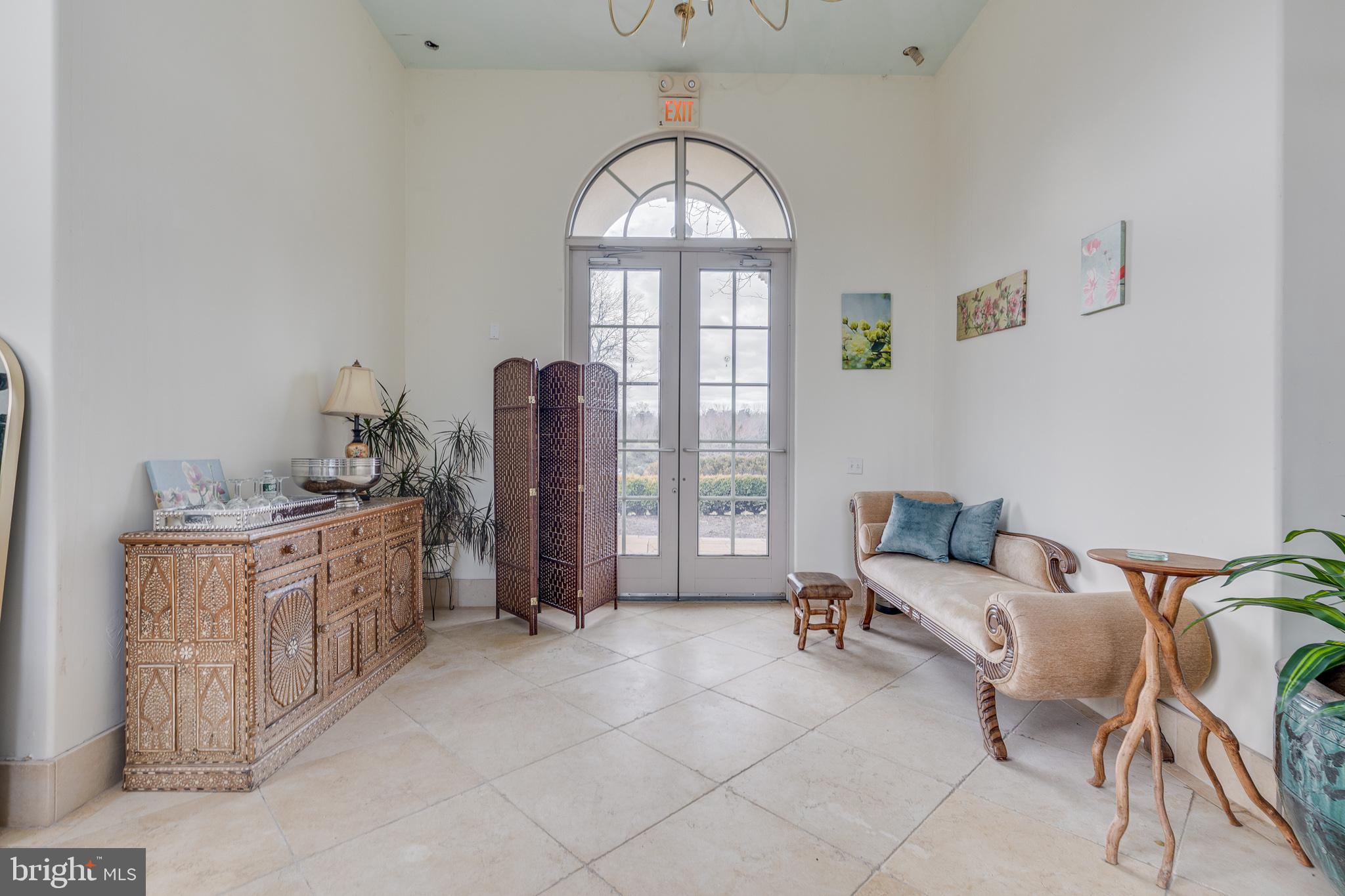 139 Bordentown Georgetown Road Chesterfield, NJ 08515 - Photo 30 of 89 a spacious bedroom with a bed and a chandelier