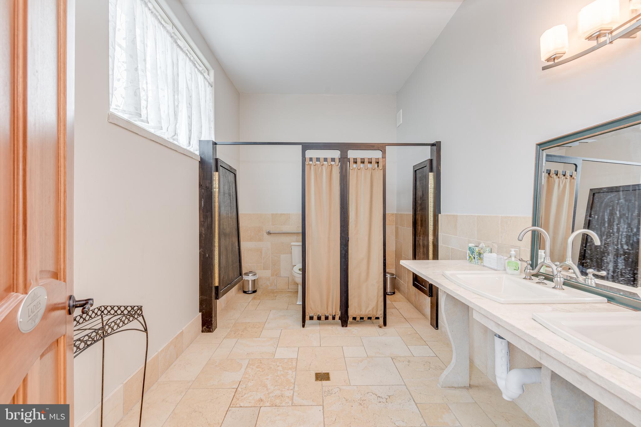 139 Bordentown Georgetown Road Chesterfield, NJ 08515 - Photo 37 of 89 a spacious bathroom with a double vanity sink a mirror and a bathtub